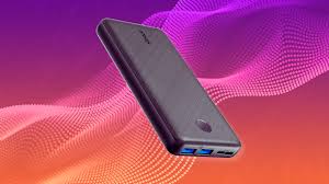 Sleek black power bank with USB ports on colorful background