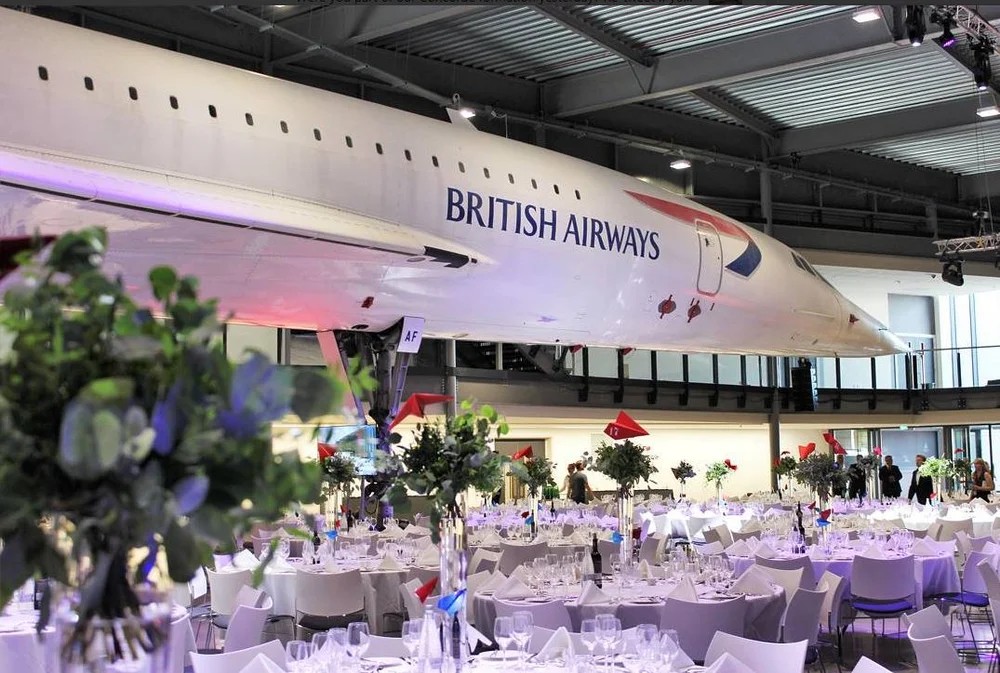 Concorde jet displayed in museum with elegant dining setup