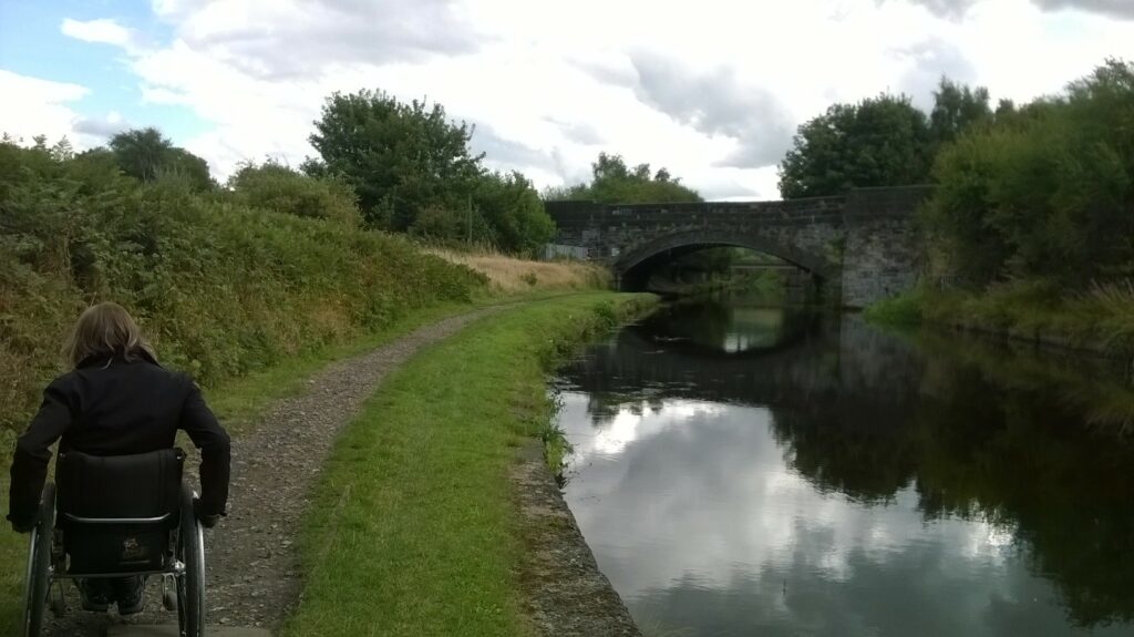 A wheelchair user on the Calder Hebble Canal.