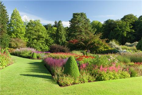 Manicured lawns and stunning flowerbeds blue sky
